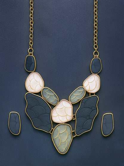 Modern gold necklace designs featuring a bib-style arrangement of multi-colored stones against a dark blue background.