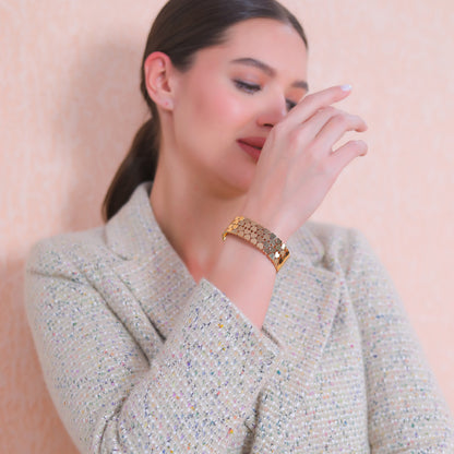 Lifestyle shot of a simple bracelet for women that adds a touch of elegance to a modern outfit.